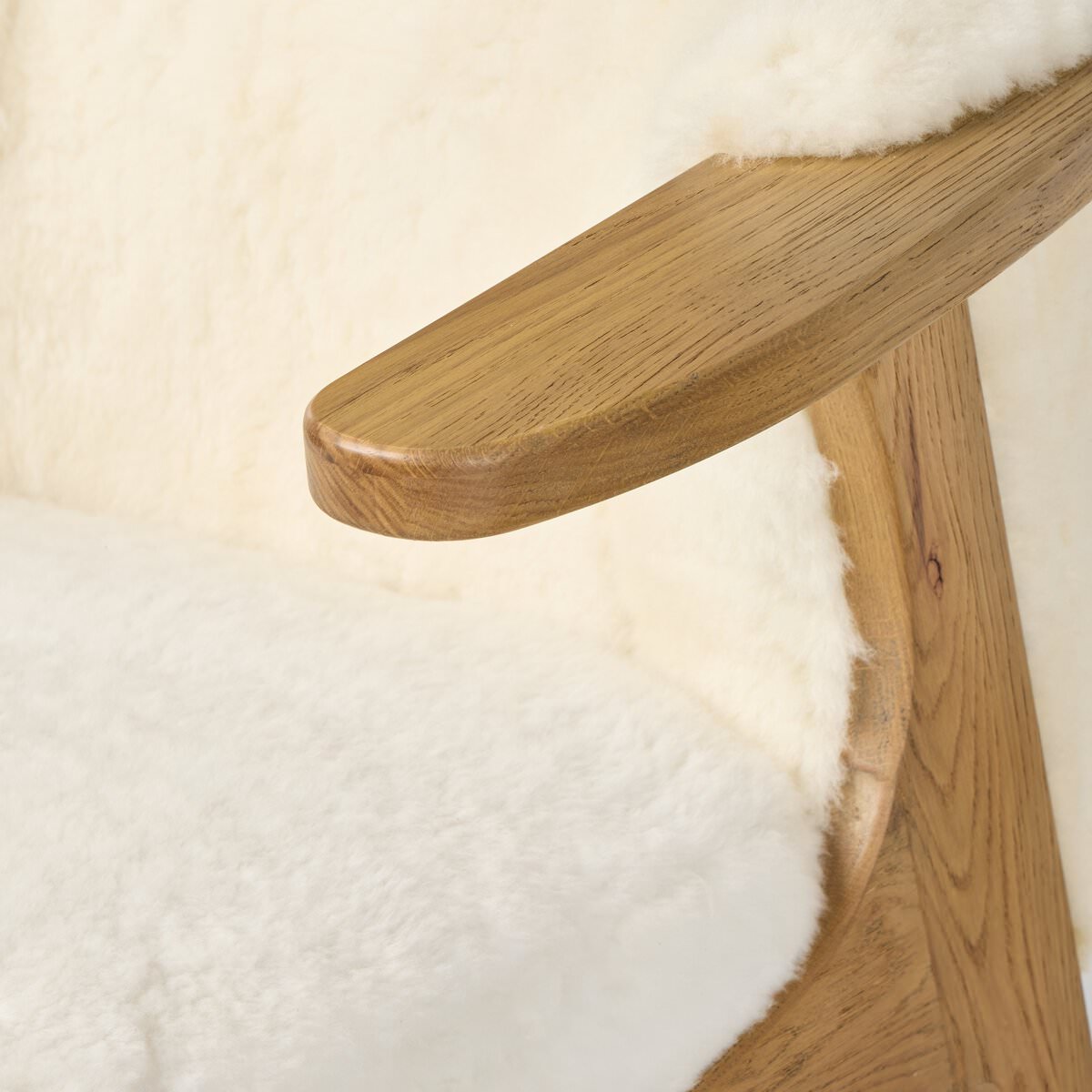Close up of Four Hands Fabian Chair in Cream Shearling on a white background at Addison West
