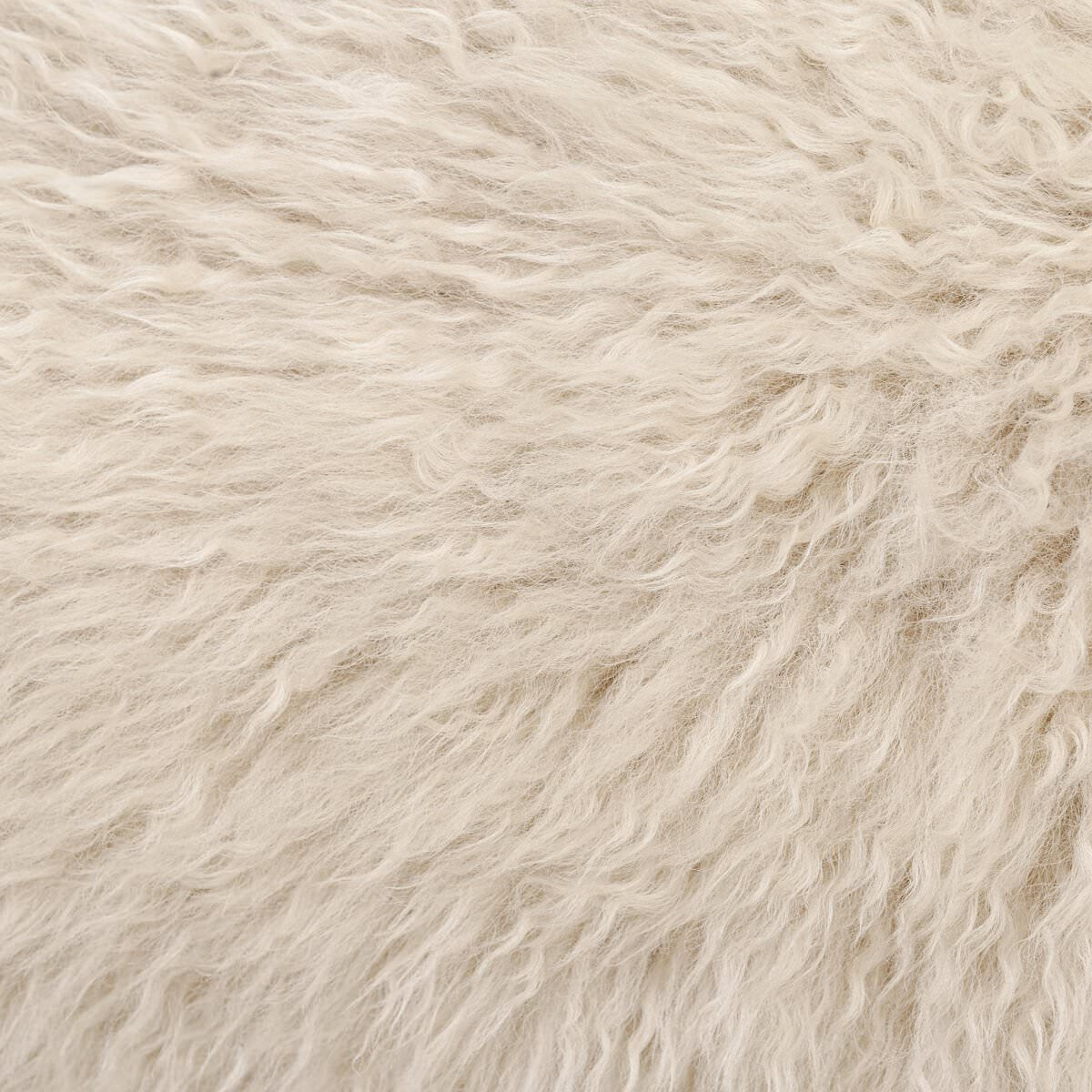 Close up of Four Hands Fenn Chair in Champagne Mongolian Fur on a white background at Addison West