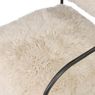Close up of Four Hands Fenn Chair in Champagne Mongolian Fur on a white background at Addison West