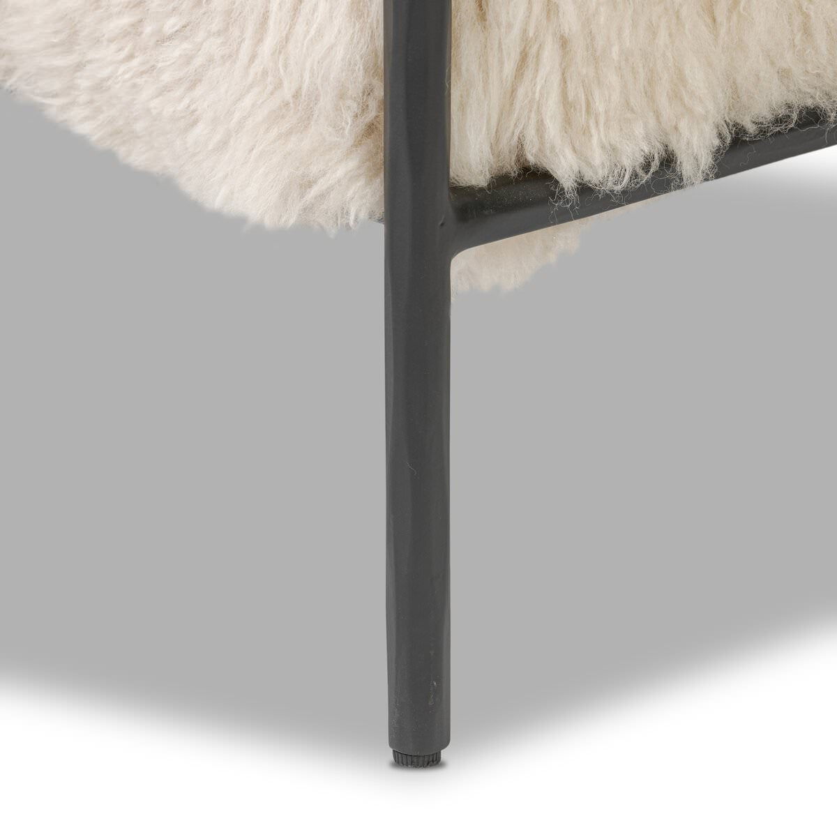 Close up of Four Hands Fenn Chair in Champagne Mongolian Fur on a white background at Addison West