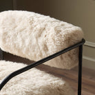 Close up of Four Hands Fenn Chair in Champagne Mongolian Fur in a living room at Addison West