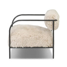 Side of Four Hands Fenn Chair in Champagne Mongolian Fur on a white background at Addison West