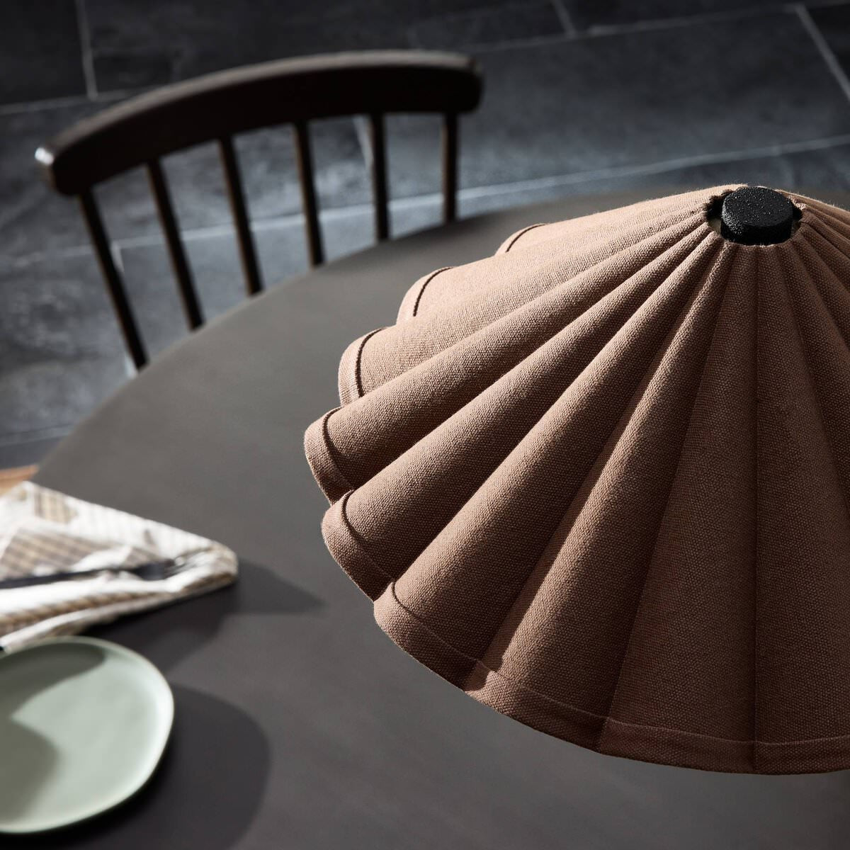 Close up of Four Hands Fiorella Chandelier in Black Wrought Iron in a dining room at Addison West