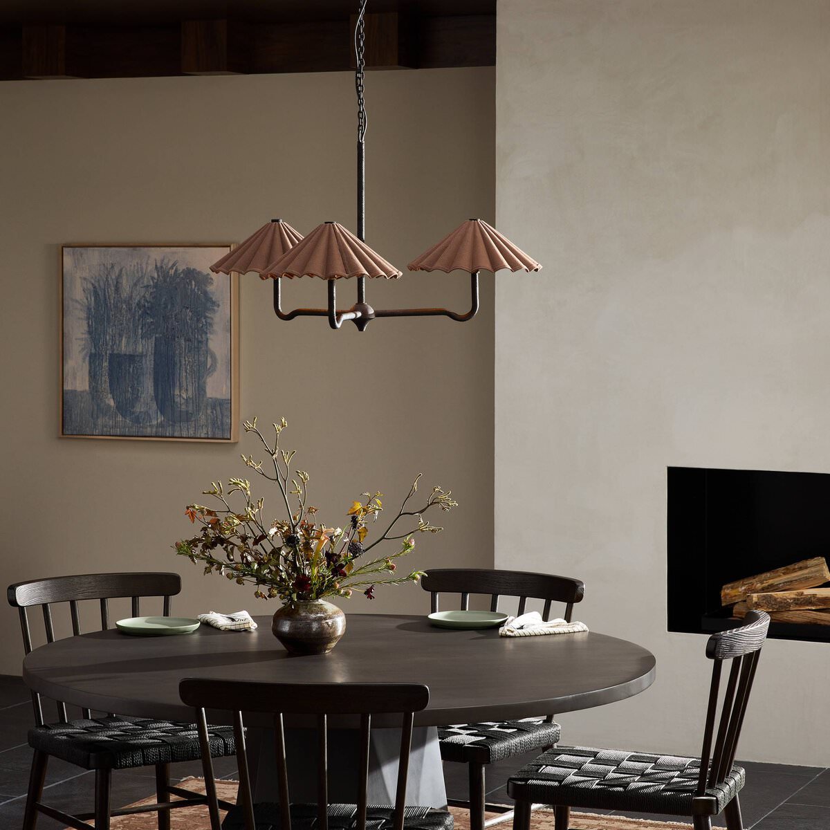 Four Hands Fiorella Chandelier in Black Wrought Iron in a dining room at Addison West