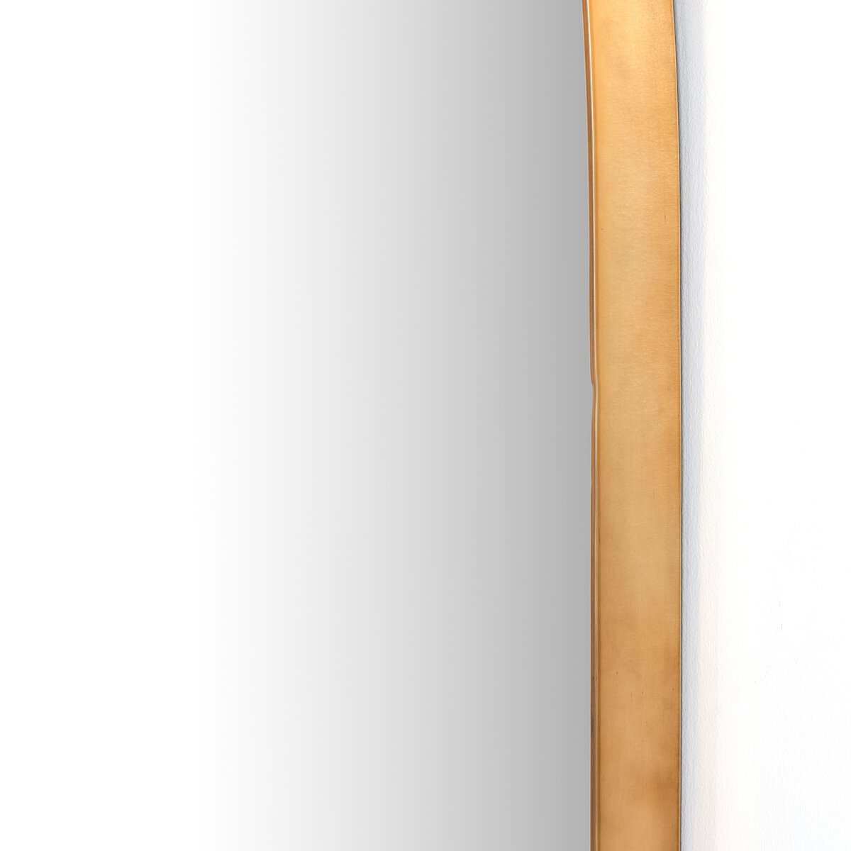 Close up of Four Hands Georgina Wide Mirror in Polished Brass on a white background at Addison West