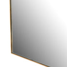 Close up of Four Hands Georgina Wide Mirror in Polished Brass on a white background at Addison West