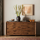 Four Hands Glenview 6 Drawer Dresser in Weathered Oak Veneer in a beige room at Addison West