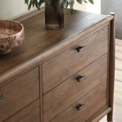 Close up of Four Hands Glenview 6 Drawer Dresser in Weathered Oak Veneer on a white background at Addison West