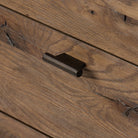 Close up of Four Hands Glenview 9 Drawer Dresser in Weathered Oak Veneer on a white background at Addison West
