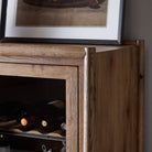 Close up of Four Hands Glenview Bar Cabinet in Weathered Oak on a white background at Addison West
