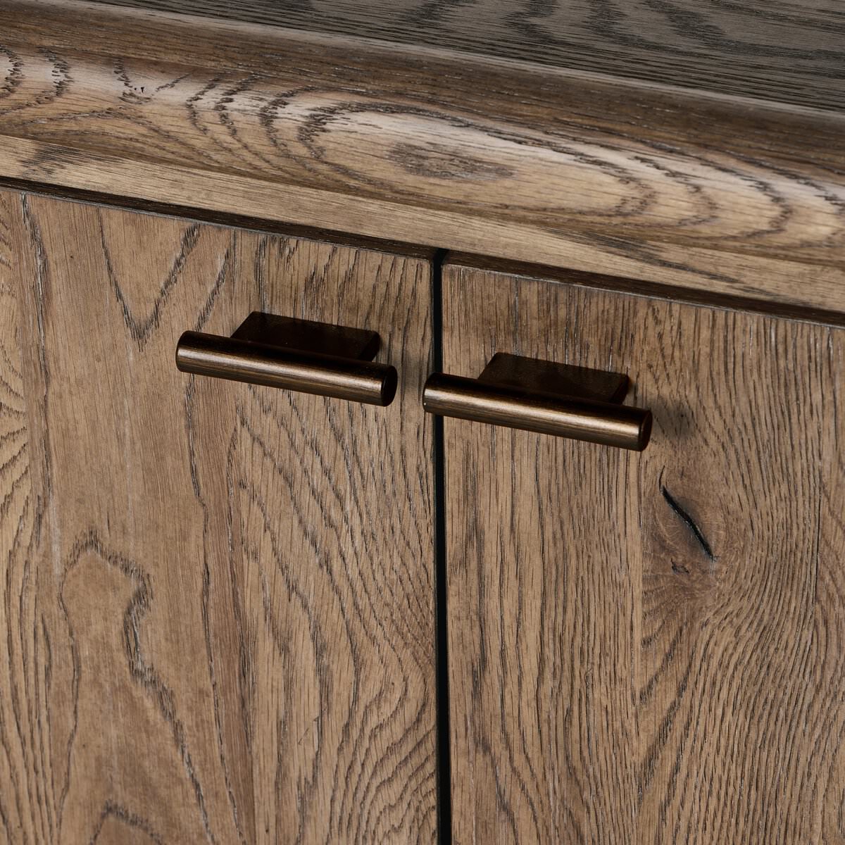 Close up of Four Hands Glenview Bookcase in Weathered Oak on a white background