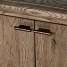 Close up of Four Hands Glenview Bookcase in Weathered Oak on a white background
