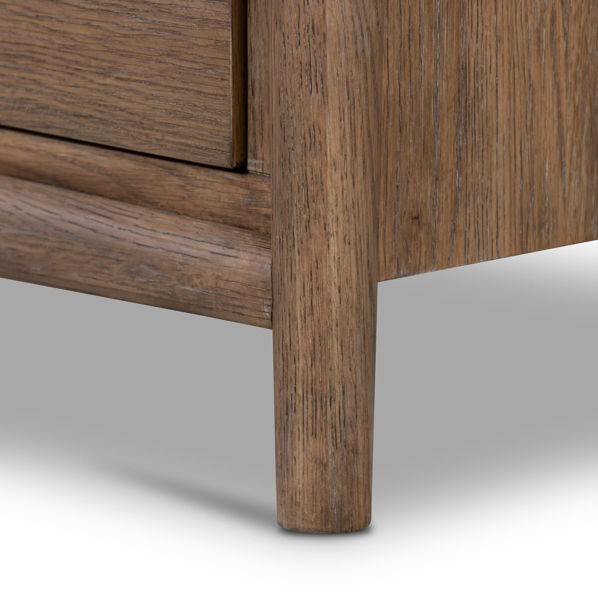 Close up of Four Hands Glenview Nightstand in Weathered Oak Veneer on a white background at Addison West