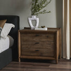 Four Hands Glenview Nightstand in Weathered Oak Veneer in a beige bedroom at Addison West