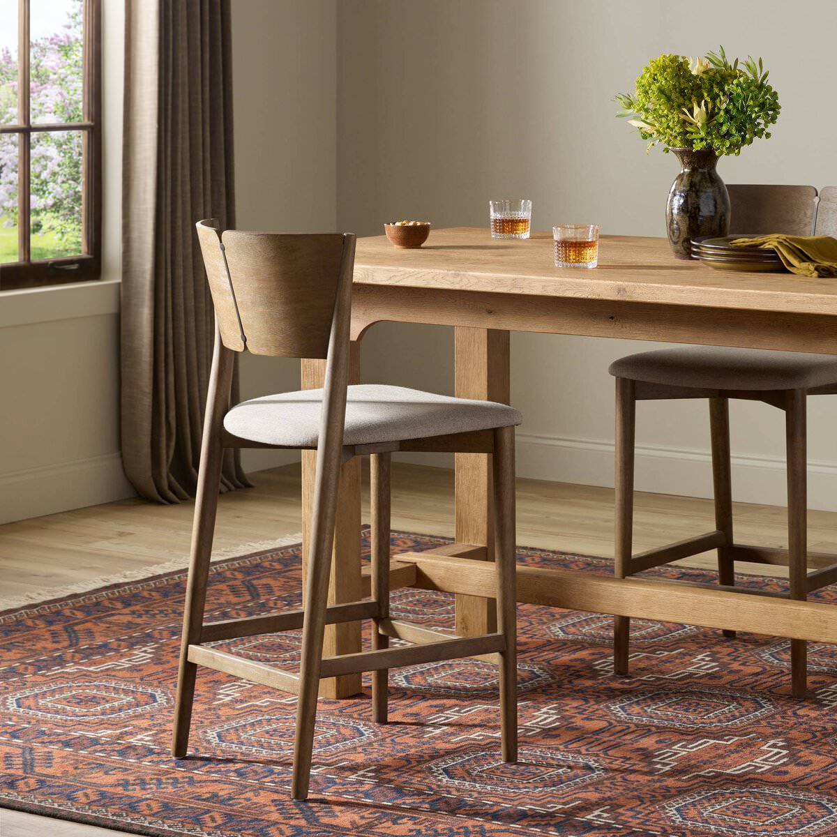 Four Hands Grady Counter Stool in Alcala Taupe in a dining room at Addison West