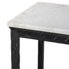 Close up of Four Hands Hammered Iron Console Table in White Marble on a white background at Addison West
