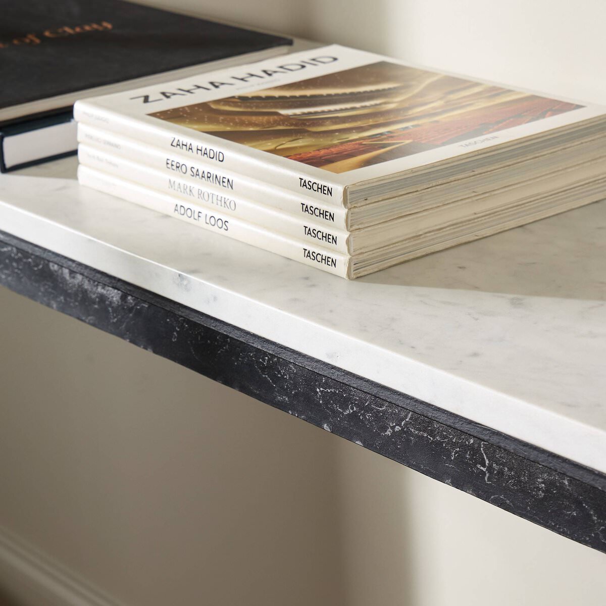Close up of Four Hands Hammered Iron Console Table in White Marble on a white background at Addison West