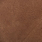 Close up of Four Hands Hanover Swivel Chair in Heirloom Sienna