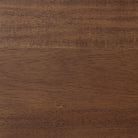 Close up of Four Hands Harper Oval Extension Dining Table 84-104" in Toasted Walnut on a white background at Addison West