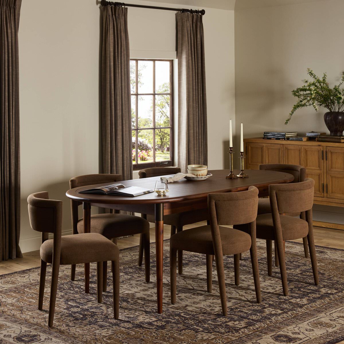 Four Hands Harper Oval Extension Dining Table 84-104" in Toasted Walnut in a traditional  dining room at Addison West