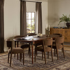 Four Hands Harper Oval Extension Dining Table 84-104" in Toasted Walnut in a traditional  dining room at Addison West