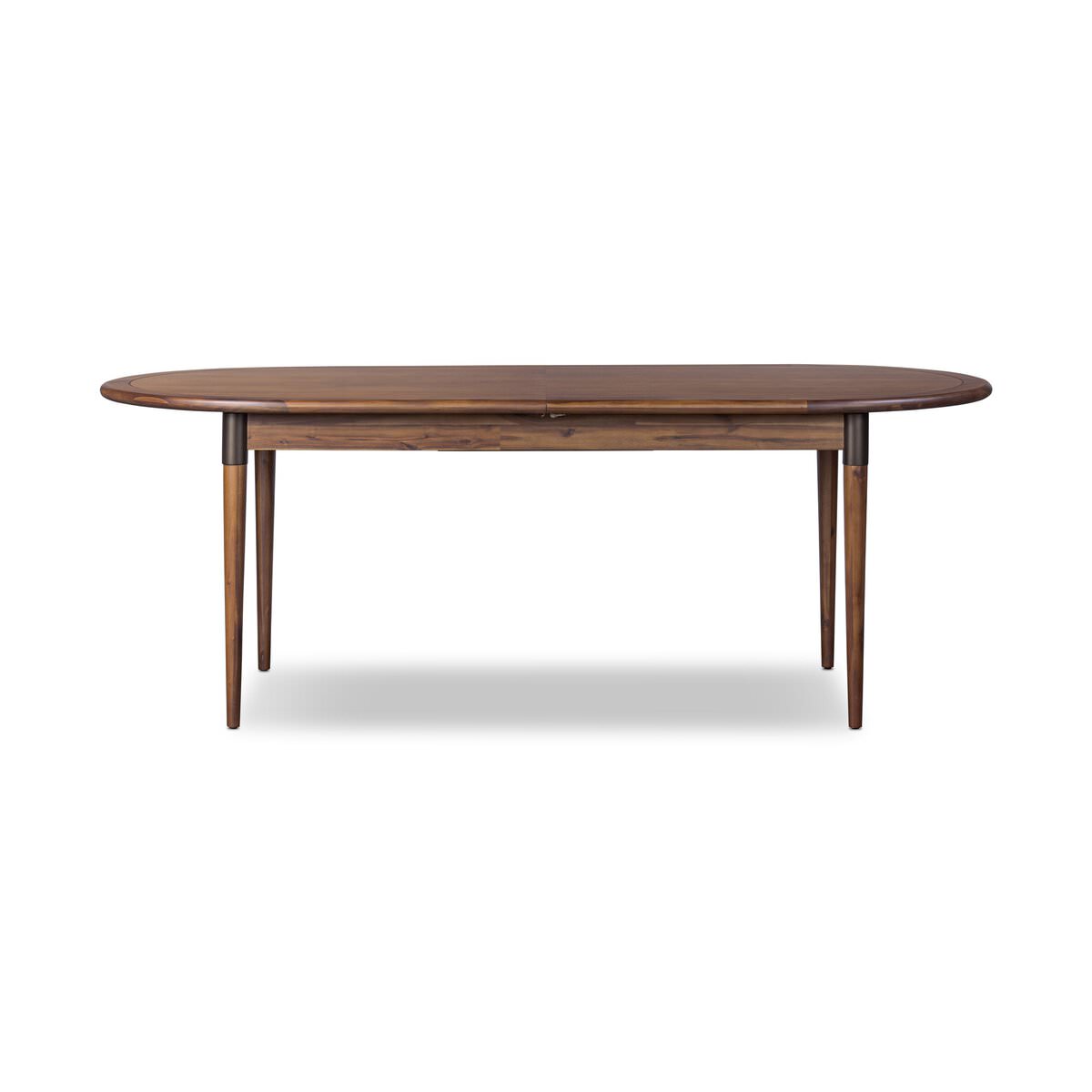 Four Hands Harper Oval Extension Dining Table 84-104" in Toasted Walnut on a white background at Addison West