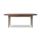 Four Hands Harper Oval Extension Dining Table 84-104" in Toasted Walnut on a white background at Addison West