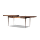 Four Hands Harper Oval Extension Dining Table 84-104" in Toasted Walnut on a white background at Addison West