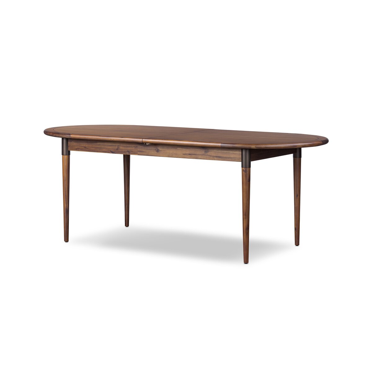 Four Hands Harper Oval Extension Dining Table 84-104" in Toasted Walnut on a white background at Addison West