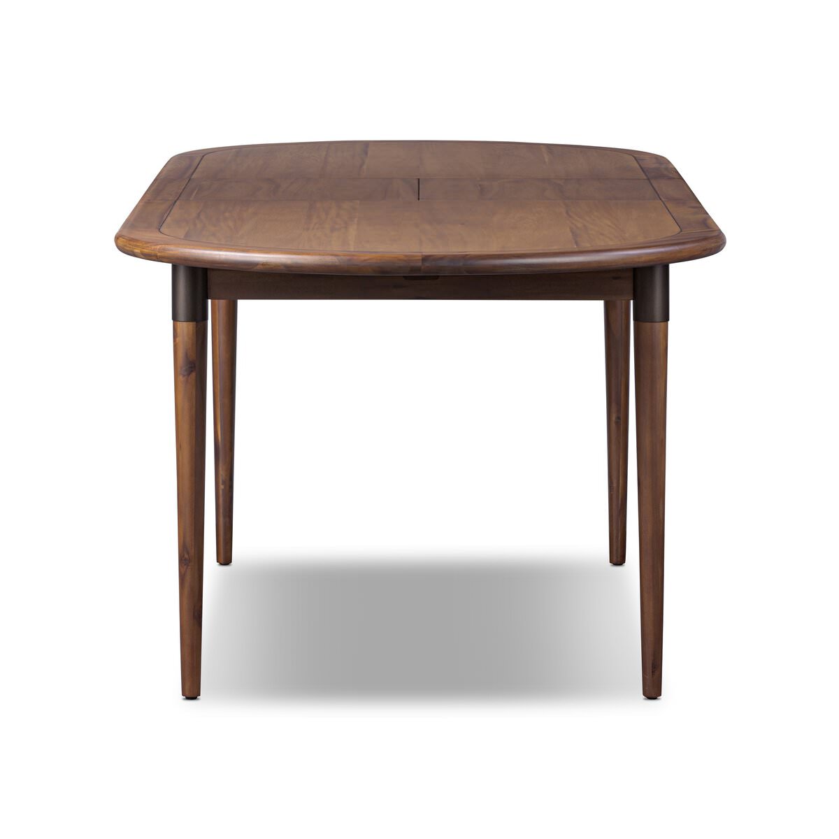 Four Hands Harper Oval Extension Dining Table 84-104" in Toasted Walnut on a white background at Addison West