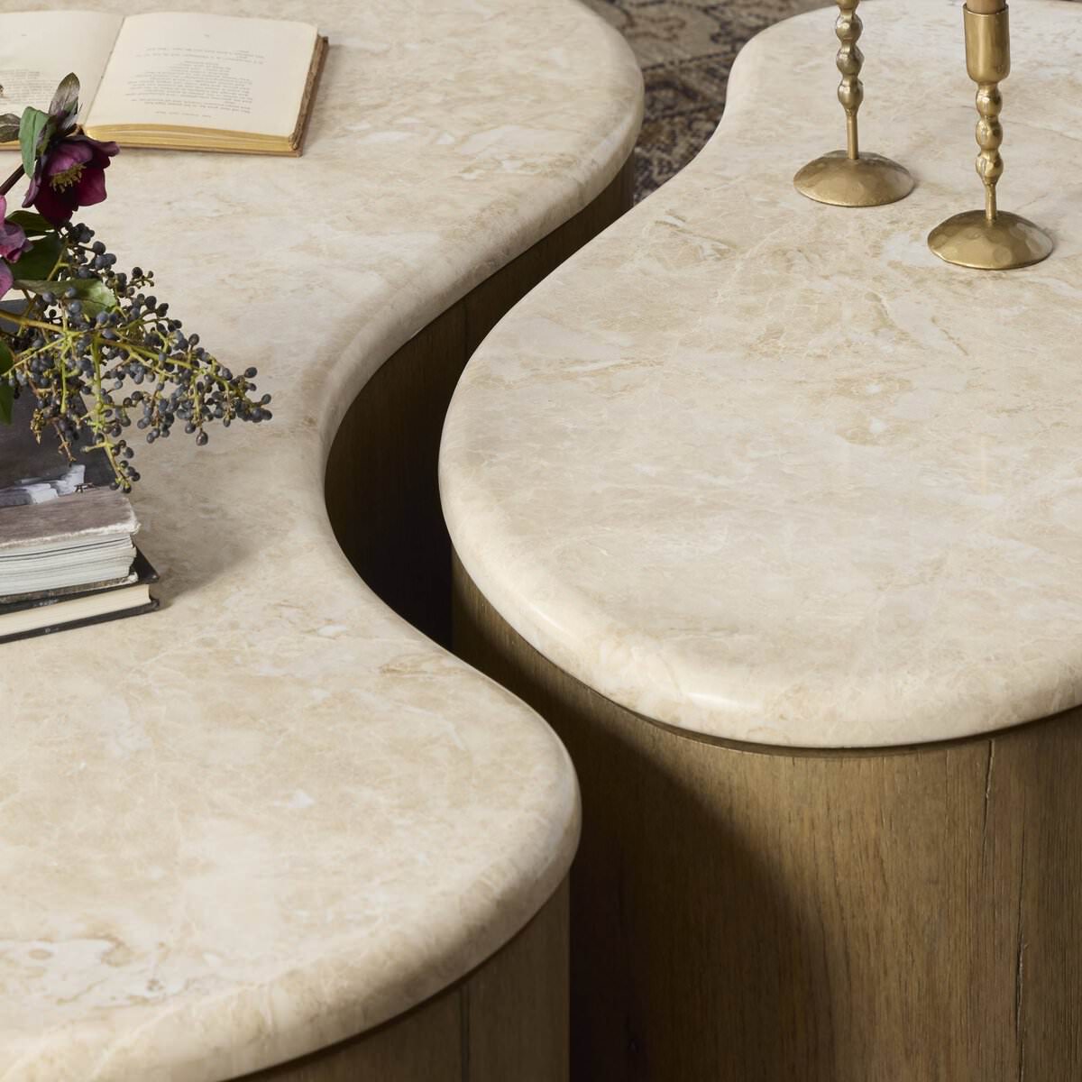 Close up of Four Hands Ingrid Coffee Table in Cappuccino Marble against a rug at Addison West