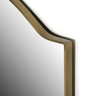 Close up of Four Hands Jacques Mirror in Antique Brass on a white background at Addison West