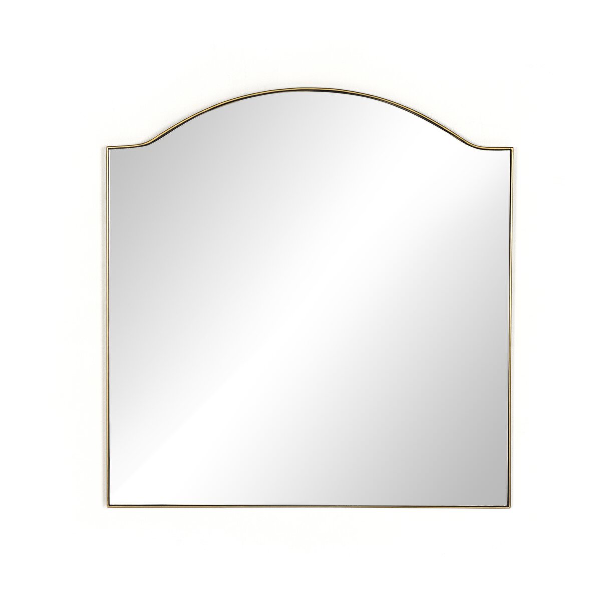 Four Hands Jacques Mirror in Antique Brass on a white background at Addison West