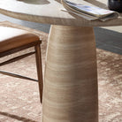 Close up of Four Hands Janice Bistro Table-36" in Sand Striae in a dining room at Addison West