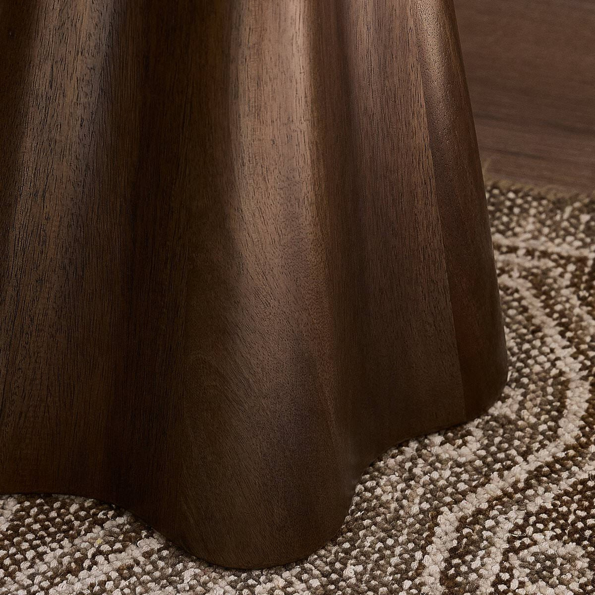 Close up of Four Hands Jinx End Table in Tawny Mango in a living room at Addison West