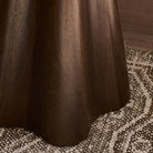 Close up of Four Hands Jinx End Table in Tawny Mango in a living room at Addison West
