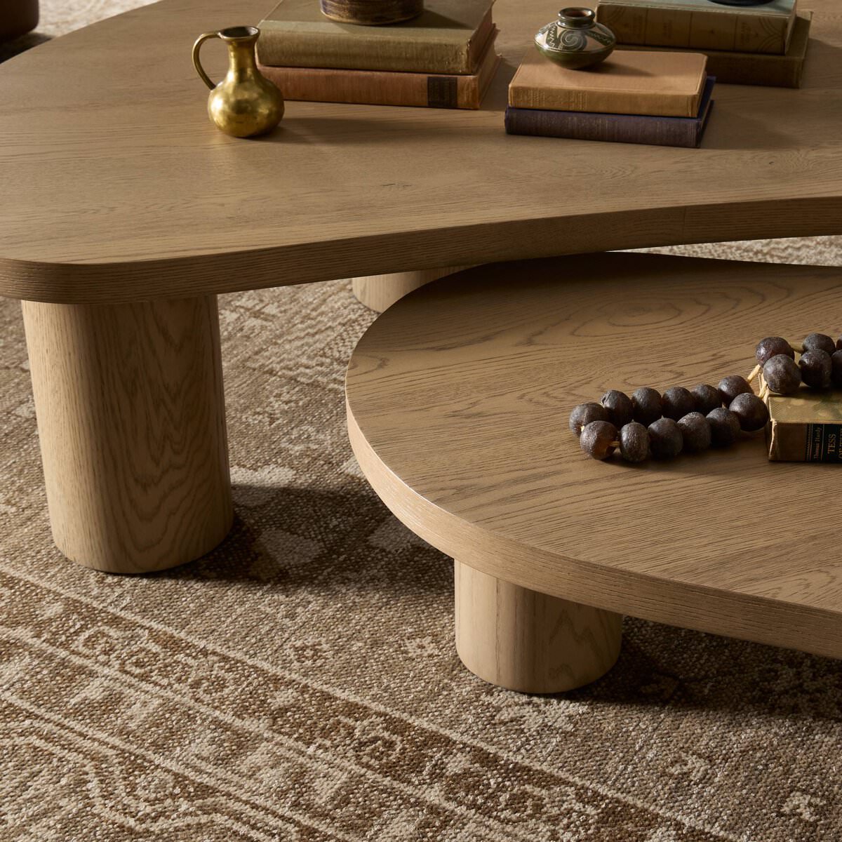 Close up of Four Hands Joji Nesting Coffee Tables in Natural Oak Veneer in a neutral living room at Addison West
