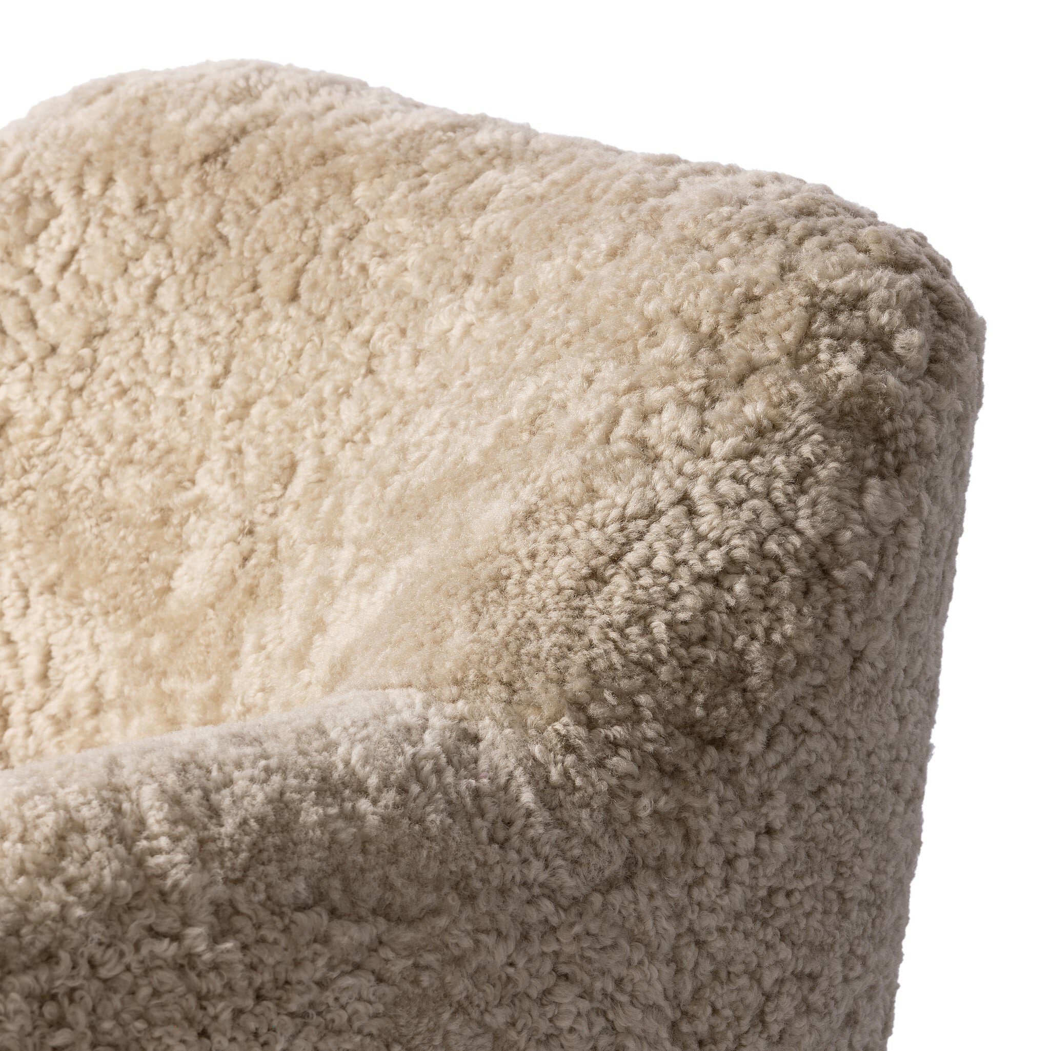 Close up of Four Hands Julius Swivel Chair in Beige Shearling on a white background at Addison West