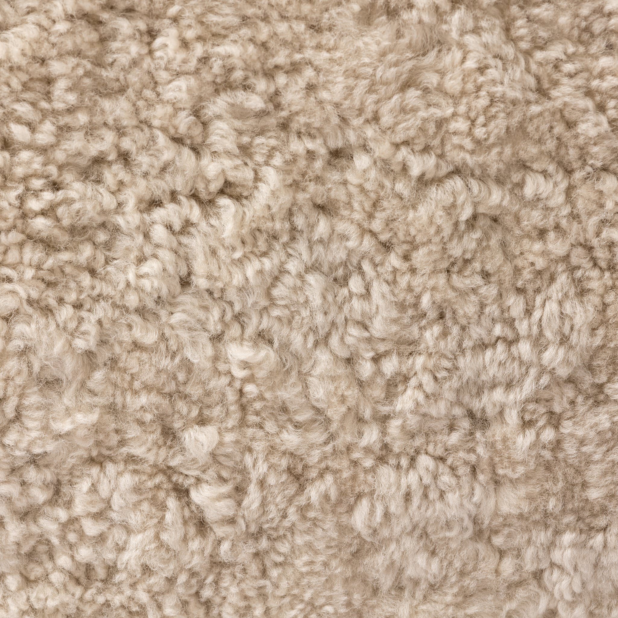 Close up of Four Hands Julius Swivel Chair in Beige Shearling at Addison West