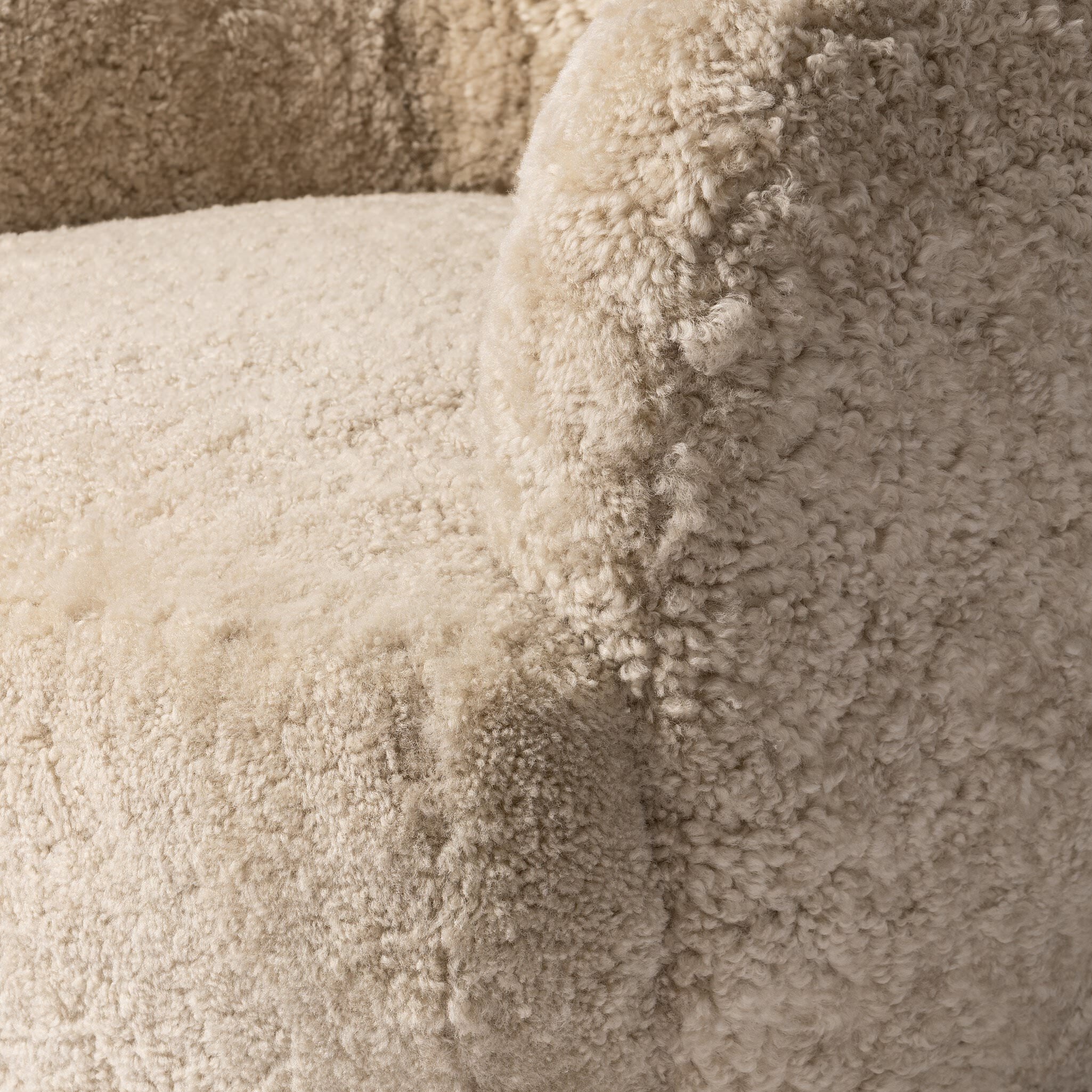 Close up of Four Hands Julius Swivel Chair in Beige Shearling at Addison West