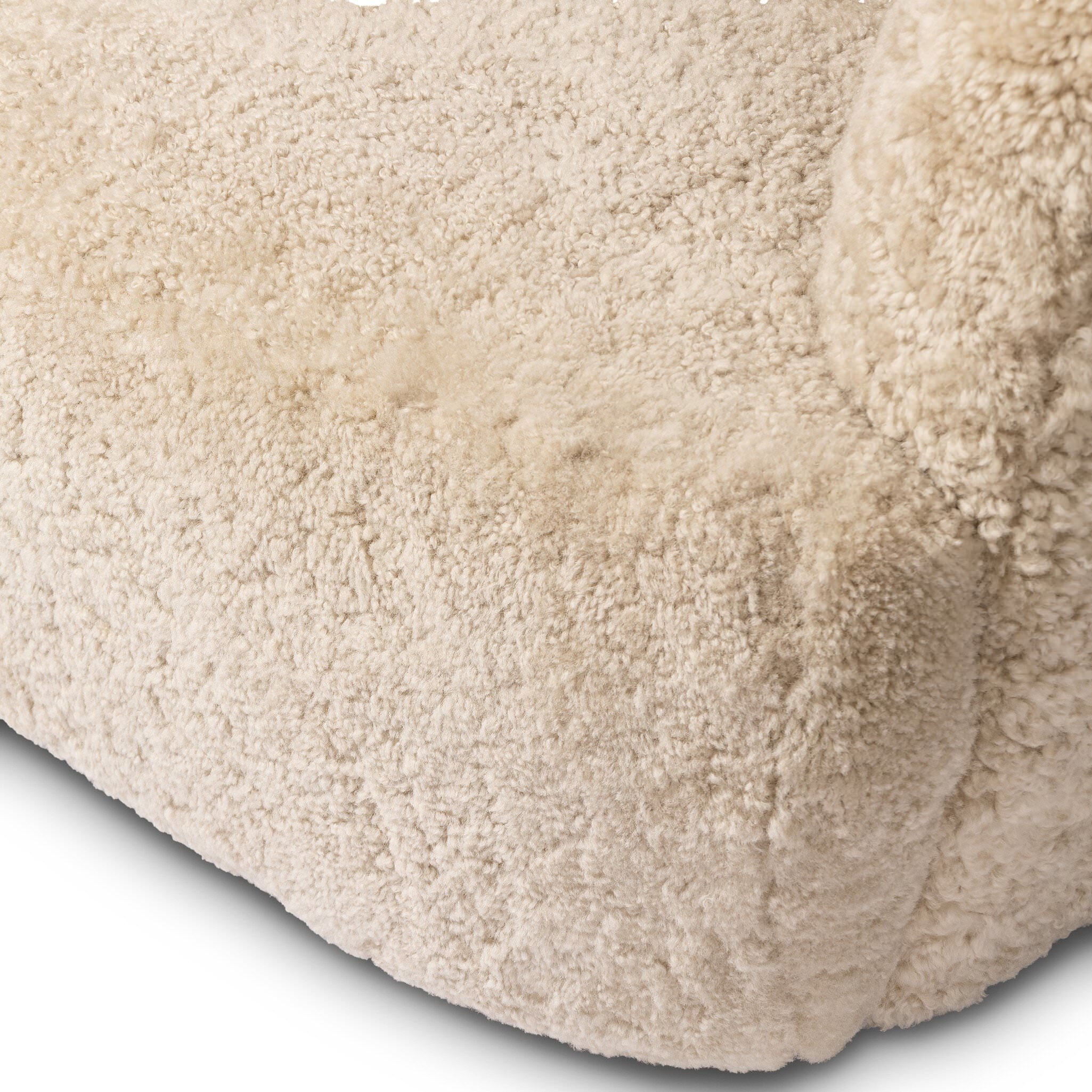 Close up of Four Hands Julius Swivel Chair in Beige Shearling on a white background at Addison West