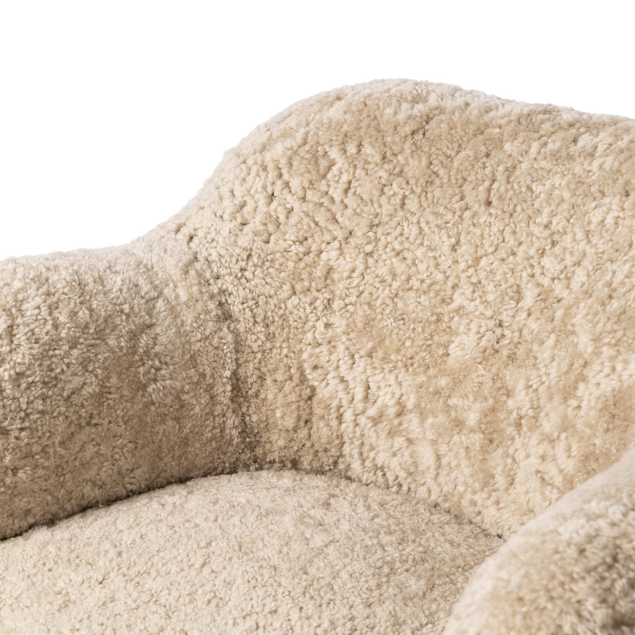 Close up of Four Hands Julius Swivel Chair in Beige Shearling on a white background at Addison West