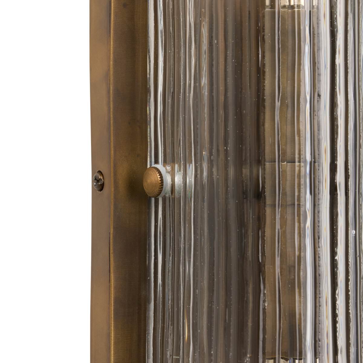 Close up of Four Hands Kenji Sconce in Clear Reeded Glass on a white background at Addison West