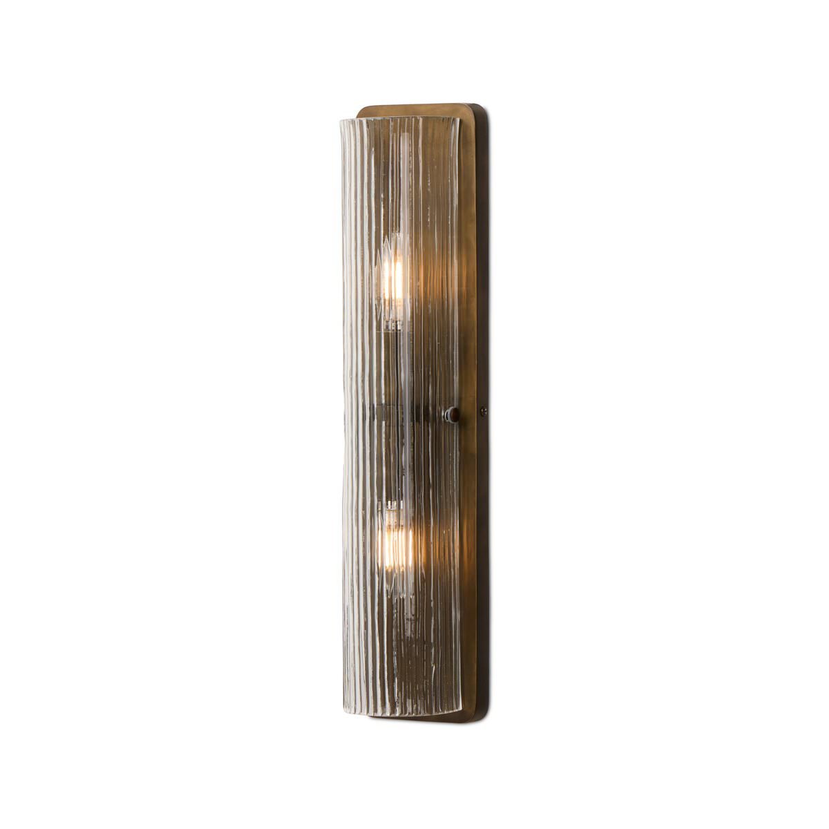 Four Hands Kenji Sconce in Clear Reeded Glass on a white background at Addison West