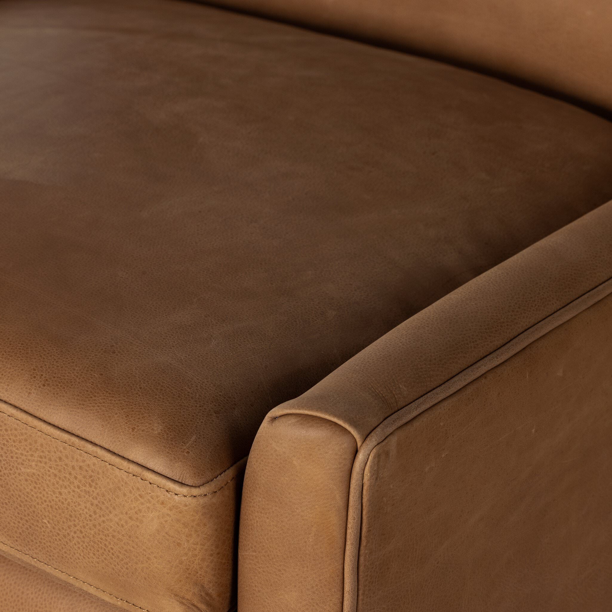 Close up of the Four Hands Marlow Wing Chair in Palermo Cognac on white background at Addison West.