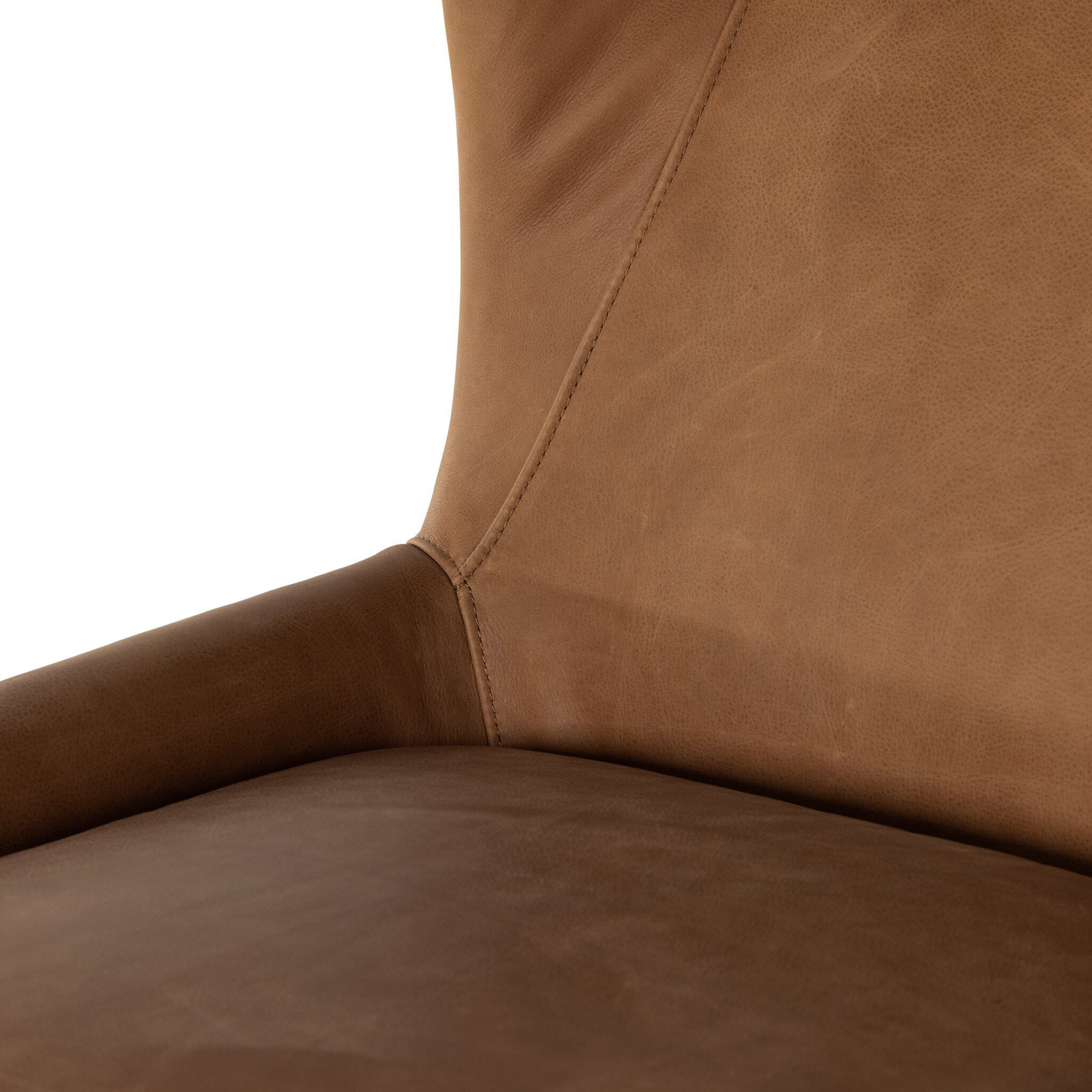 Close up of the Four Hands Marlow Wing Chair in Palermo Cognac on white background at Addison West.