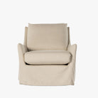 Four Hands Monette Slipcover Swivel Chair In Brussels Natural on a white background
