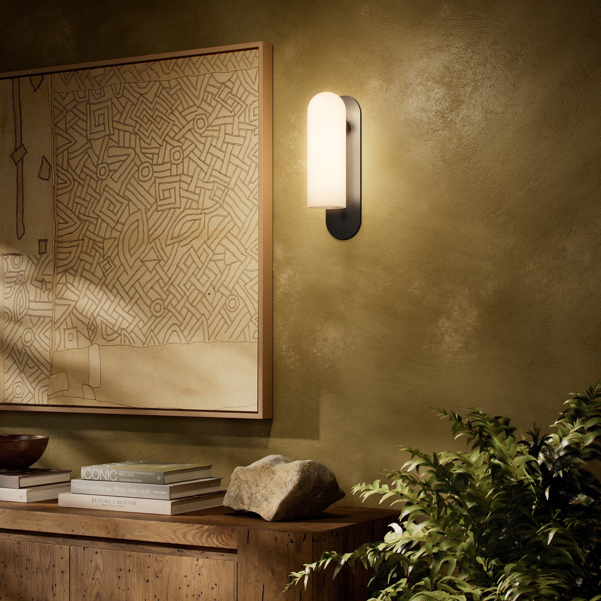 Four Hands Odyssey Sconce in Black Gunmetal with Opal Matte Glass, 15" in living room at Addison West.