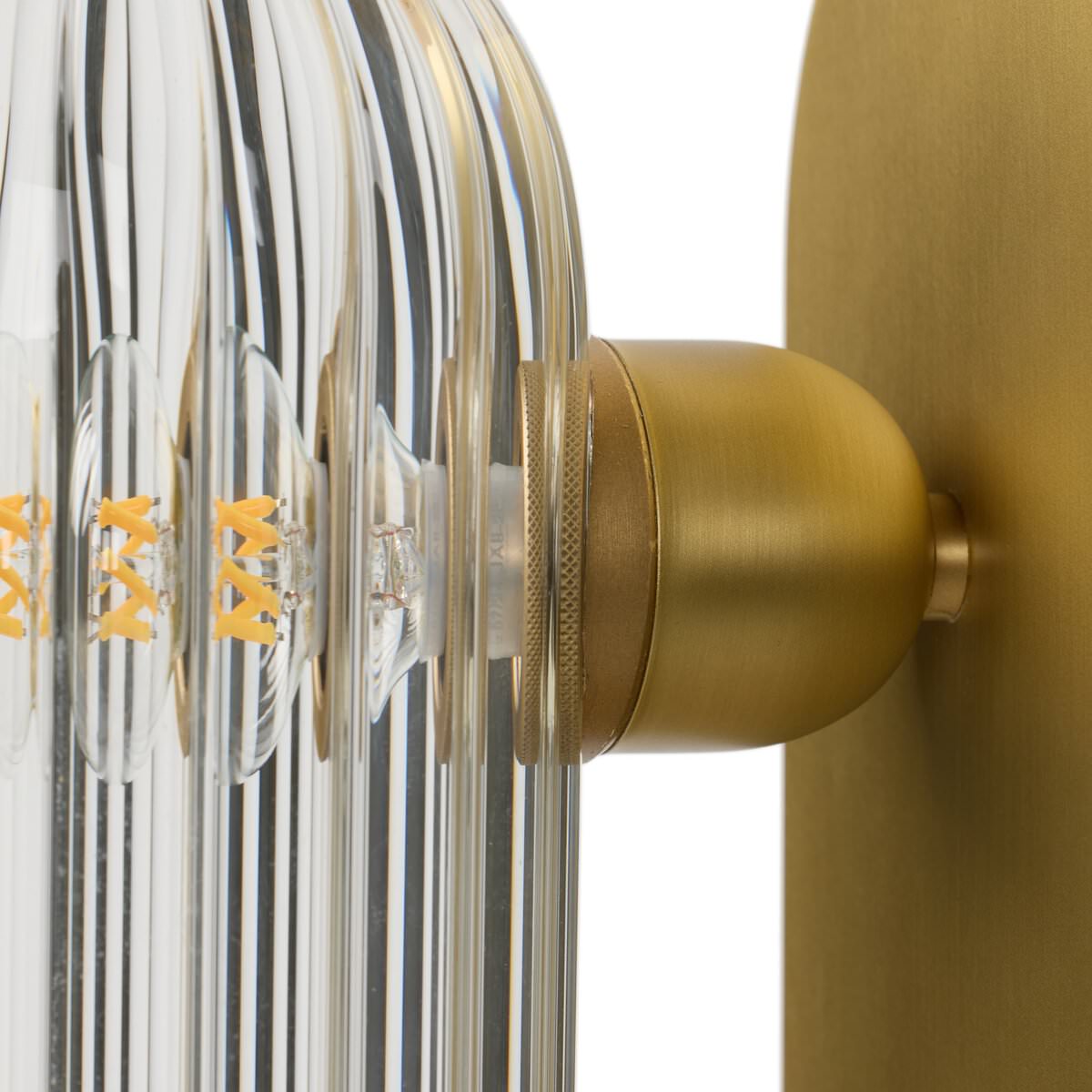 Close up of Four Hands Odyssey Sconce in Burnished Brass on a white background at Addison West