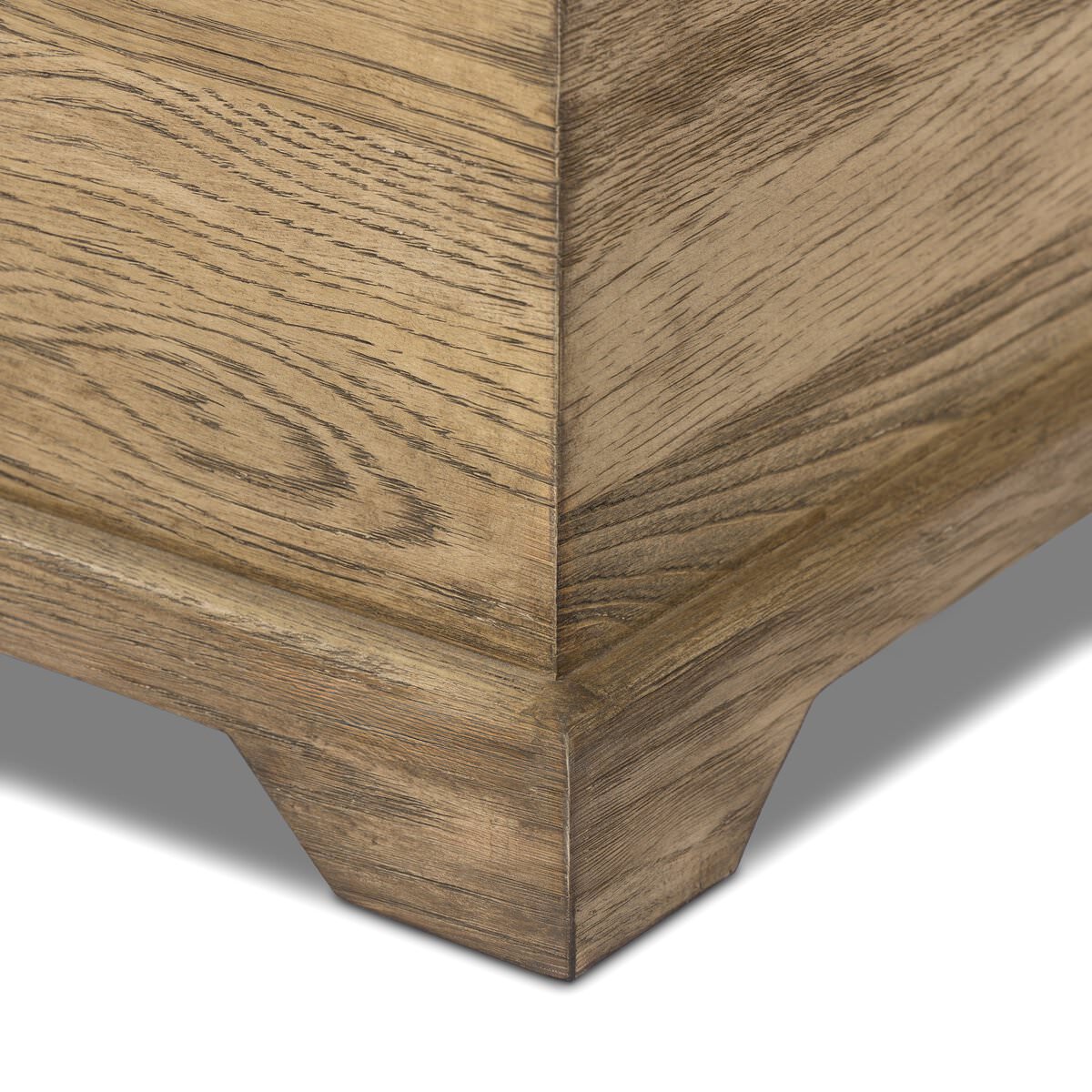 Close up of Four Hands Quintin Trunk in Worn Oak on a white background at Addison West